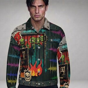 May include: A dark green denim jacket with a colorful zombie-themed graphic design. The jacket features a skull and flames, along with a variety of zombie illustrations. The jacket has a button-up front and metal rivets.