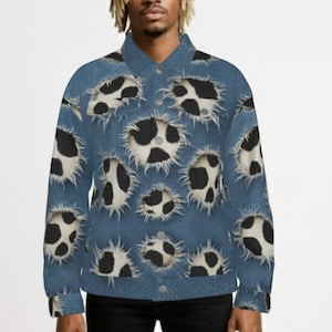 May include: A denim jacket with a unique pattern of black and white cow spots. The jacket has a button-up front and long sleeves. The cow spot design is distributed across the jacket's surface.