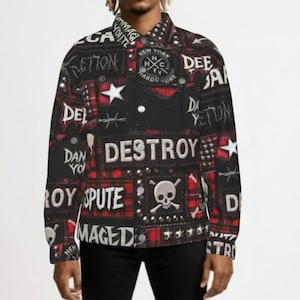 May include: Black and red plaid jacket with studded accents and various text graphics, including "DESTROY" and "DAMAGED." The jacket features a button-up front and a skull and crossbones design.