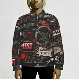 May include: Black and red button-up jacket with a collage of graphic text and illustrations. The jacket features the words "TEST", "DAMAGED YOUTH", and "DEPRESSION". The design includes red triangles and a central emblem with an eagle.