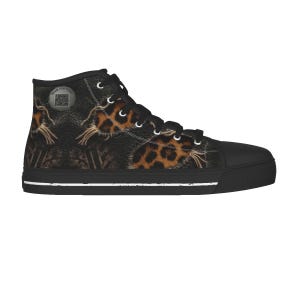 May include: High-top canvas sneakers with a black toe cap and sole. The upper features a leopard print design with a black background. The laces and eyelets are black, and a white stripe accents the sole. The text "Scan for Music" is visible on the side.