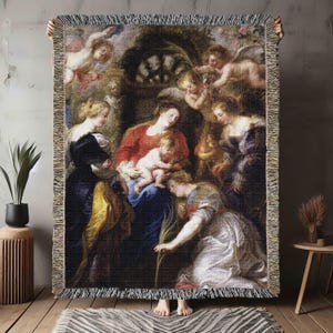 May include: A tapestry woven with a Renaissance-style painting depicting a group of figures, including a woman holding a baby, surrounded by angels. The tapestry features rich colors and intricate details.