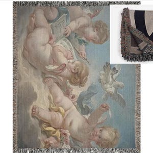 May include: A tapestry throw blanket featuring a vintage illustration of cherubs playing music in a sky with clouds. The cherubs are depicted in a light pink and white color scheme.