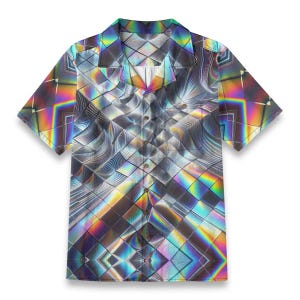 May include: Short-sleeved button-down shirt with a geometric, iridescent design. The shirt features a kaleidoscope pattern in shades of silver, gray, and rainbow colors. The shirt has a classic collar and button closure.