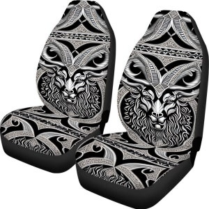May include: Two black car seat covers with a white and silver design featuring a stylized ram's head.