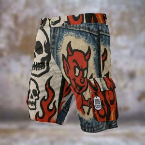 May include: Denim shorts with a bold design featuring skulls, flames, and a red devil graphic. The shorts have a cargo pocket with a tag that reads "DAMAGED YOUTH". The design is printed on a light-colored fabric with a denim texture.