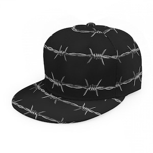 May include: A black baseball cap with a repeating white barbed wire pattern. The cap has a flat peak and a structured crown. The barbed wire design covers the entire cap, including the peak and the top.
