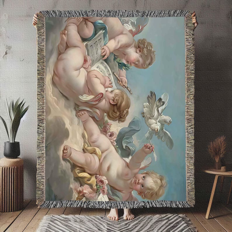 May include: A tapestry wall hanging featuring a vintage illustration of three cherubs with wings. The cherubs are depicted in a light blue, white, and pink color scheme. One cherub is holding a musical score and a quill pen, while another cherub is holding a dove.