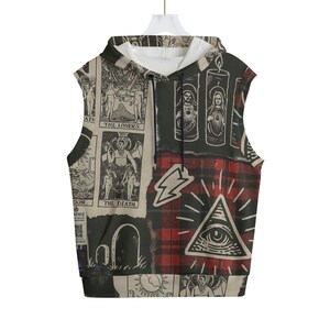 May include: Sleeveless hoodie with a unique collage design. The design incorporates tarot card imagery, a red and black plaid pattern, and an eye within a triangle. The hoodie has a white interior and a drawstring.