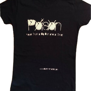 May include: Black t-shirt with a white graphic of the word "Poison" with a drum set design. The text "Never Trust a Big Butt and a Smile" is below the graphic. The website "www.poison.com" is printed on the bottom of the shirt.