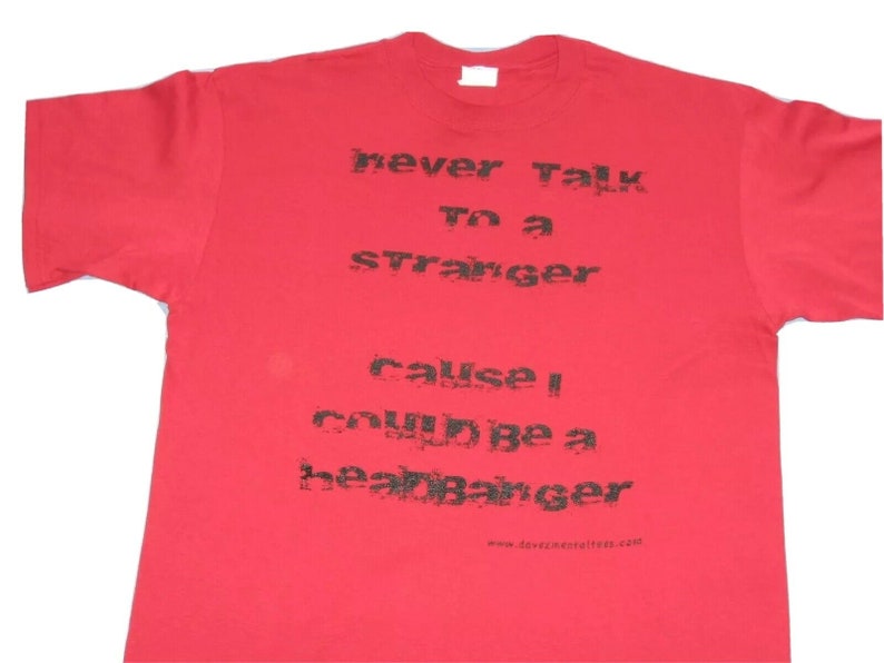 May include: Red t-shirt with black text that reads "never talk to a stranger cause I could be a heart banger" and a website address at the bottom.