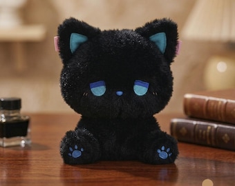 May include: A plush black cat toy with soft fur, featuring bright blue accents on the inner ears, eyes, and paw pads. The cat has a small blue nose and closed, sleepy-looking eyes. It is a seated stuffed animal with a rounded head and body.