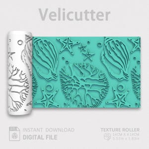 May include: A white cylindrical texture roller with a repeating sea life pattern featuring seashells, starfish, and coral. The digital file, labeled Velicutter, shows a teal-colored sample print measuring 5.51 inches by 1.63 inches.