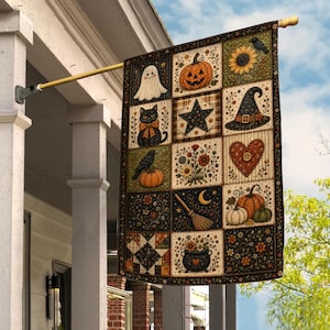 May include: A rectangular outdoor flag featuring a patchwork design with twelve squares displaying Halloween motifs including a ghost, a jack-o'-lantern, a black cat, a star, a witch hat, a heart, a crow, flowers, a broom, pumpkins, and a cauldron.