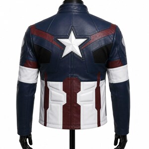 May include: A navy blue, white, and dark red leather jacket featuring a prominent white star emblem on the upper back. The design includes structured paneling, black mesh accents at the shoulders, and a high collar, mimicking a superhero aesthetic.