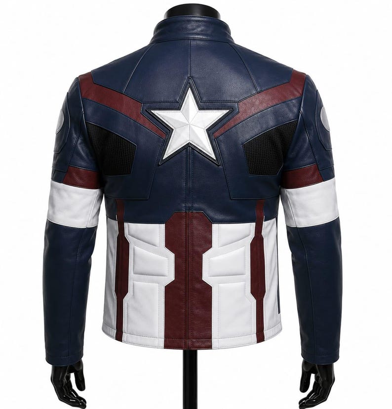 May include: A navy blue, white, and dark red leather jacket featuring a prominent white star emblem on the upper back. The design includes structured paneling, black mesh accents at the shoulders, and a high collar, mimicking a superhero aesthetic.