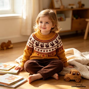 May include: A mustard yellow knit jumper featuring a circular yoke pattern with brown squirrels, acorns, and red maple leaves. The jumper has a ribbed crew neckline and long sleeves with matching patterned cuffs, worn with dark brown corduroy trousers.