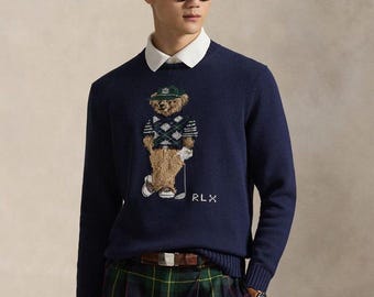 Suéter Polo Ralph Lauren azul marinho de gola redonda, estilo golfista, com gola redonda e design clássico.
