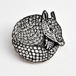 Armadillo Brooch, curled up armadillo pin badge.