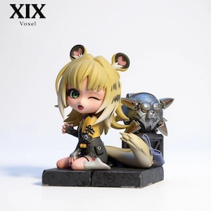 May include: A chibi-style figurine featuring a character with blonde hair, animal ears, and a yellow and black outfit. The character is kneeling on a dark base next to a metallic, spherical object with spikes. The text XIX Voxel appears in the corner.