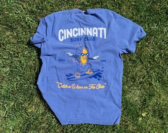 Surf Cincinnati themed tshirt with a hotdog coney skyline theme on Periwinkle Color Comfort
