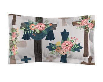 Fronha decorativa cristã com estampa floral e cruz