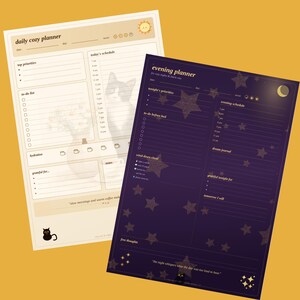 Puede incluir: Dos planificadores de papel rectangulares. El planificador izquierdo es de color crema con un icono de sol, una ilustración de gato y el texto daily cozy planner. El derecho es de color morado oscuro con estrellas, una luna y el texto evening planner.