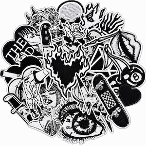 May include: A collection of black and white embroidered patches featuring various designs including a flaming heart, a skateboard, a rose, a human eye, a figure with a bucket head, a knife, cherries with an eight ball, and the text THE GOD.