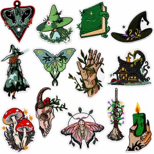 May include: A collection of thirteen embroidered patches featuring various designs including a planchette, witch hats, a green book, a moth, a butterfly, a hand with vines, a house, mushrooms, a skull, a broom, and a hand holding a green candle.