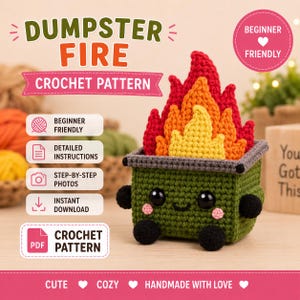 May include: A crochet pattern for a dumpster fire, featuring a green dumpster with black wheels and handles, and flames in red, orange, and yellow. The dumpster has black eyes and pink cheeks. Text includes DUMPSTER FIRE CROCHET PATTERN.