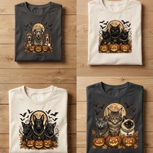 Könnte beinhalten: Vier gefaltete T-Shirts in Anthrazit und Creme. Jedes Shirt zeigt einen Grafikdruck von drei Tieren, darunter Hunde und Katzen, die Goldketten tragen, vor einem Vollmond, fliegenden Fledermäusen und drei leuchtenden Kürbissen.