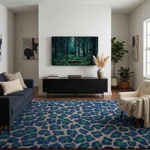 May include: A large area rug featuring a repeating leopard print pattern in shades of deep blue and vibrant green against a neutral beige background. The rug is positioned in a living room setting with a dark blue sofa and a cream-colored armchair.