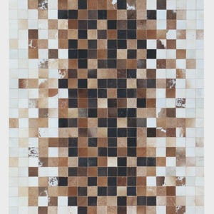 May include: A rectangular area rug constructed from a grid of small square tiles made of cowhide. The pattern features a gradient of colours transitioning from white and light tan at the outer edges to dark brown and black squares in the centre.