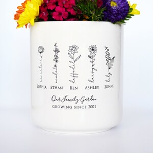 Personalized birth flower flower pot, planter, or vase is the perfect gift for Grandma, Mom, Aunt, or any loved one. The name of the birth flower is written on the stem with the family member's name underneath.