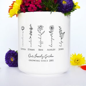 Personalized birth flower flower pot, planter, or vase is the perfect gift for Grandma, Mom, Aunt, or any loved one. The name of the birth flower is written on the stem with the family member's name underneath.