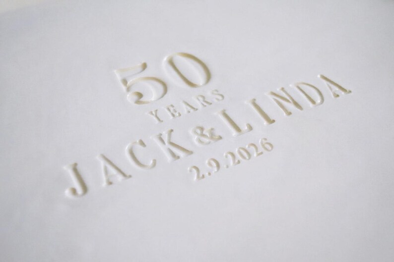 A white, oval-shaped serving platter with a wavy edge. The text reads "50 YEARS JACK & LINDA 2.9.2026". The platter is an anniversary gift.