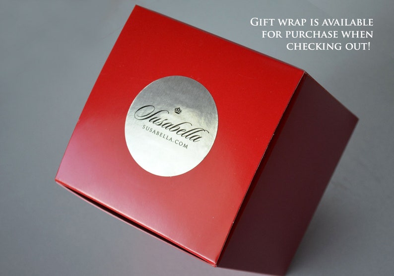 May include: A red box with a silver sticker that says "Susabella" and "susabella.com". The text "GIFT WRAP IS AVAILABLE FOR PURCHASE WHEN CHECKING OUT!" is printed on the box.
