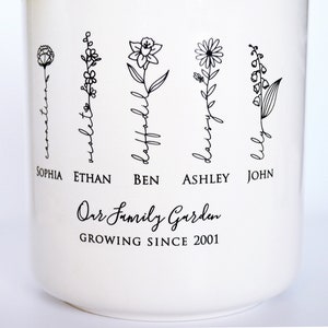 Personalized birth flower flower pot, planter, or vase is the perfect gift for Grandma, Mom, Aunt, or any loved one. The name of the birth flower is written on the stem with the family member's name underneath.