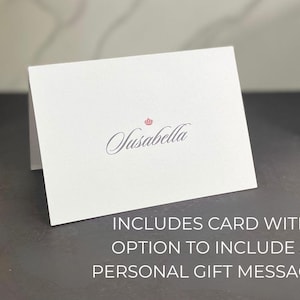 May include: White card with the text "Susabella" in cursive script and a small crown above the text. The card includes the text "INCLUDES CARD WITH OPTION TO INCLUDE A PERSONAL GIFT MESSAGE".