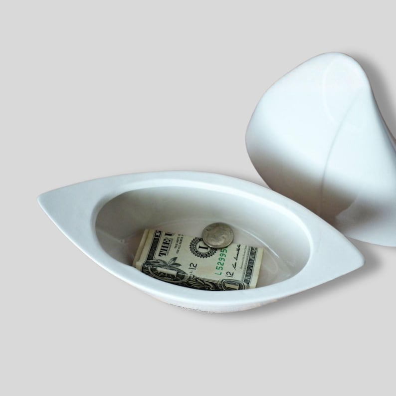 boat-shaped ceramic box with money inside - white - lid off