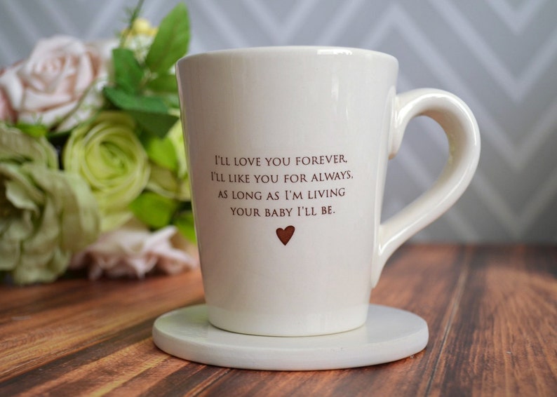 This sweet ceramic mug would be a perfect Mothers Day gift. It's made of earthenware clay and has this text printed on it: I'll Love You Forever, I'll Like You for Always, As Long as I'm Living Your Baby I'll Be.