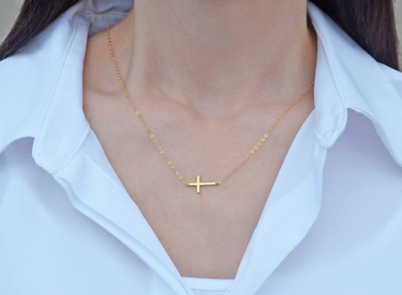 This cross necklace comes with a heart-shaped keepsake box would be a perfect baptism, christening, first communion, or confirmation gift. It has an Irish blessing inside.