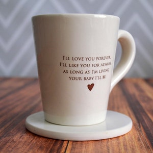 This sweet ceramic mug would be a perfect Mothers Day gift. It's made of earthenware clay and has this text printed on it: I'll Love You Forever, I'll Like You for Always, As Long as I'm Living Your Baby I'll Be.