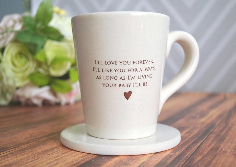 This sweet ceramic mug would be a perfect Christmas, Birthday or Mothers Day gift. It's made of earthenware clay and has this text printed on it: I'll Love You Forever, I'll Like You for Always, As Long as I'm Living Your Baby I'll Be.