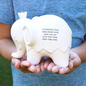 white ceramic piggy bank with personalized message on back