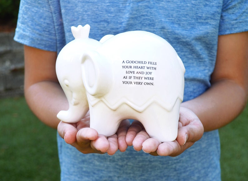 white ceramic piggy bank with personalized message on back