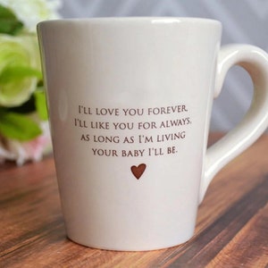 This sweet ceramic mug would be a perfect Mothers Day gift. It's made of earthenware clay and has this text printed on it: I'll Love You Forever, I'll Like You for Always, As Long as I'm Living Your Baby I'll Be.