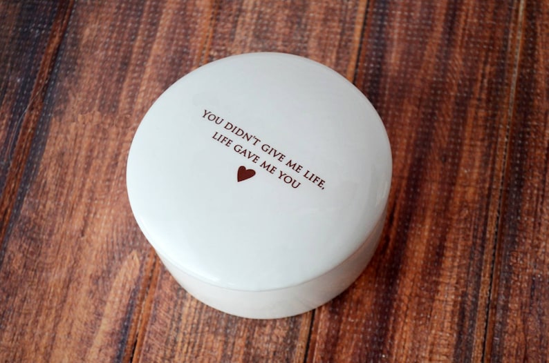 May include: White ceramic trinket box with the text "You didn't give me life, life gave me you" and a small red heart.