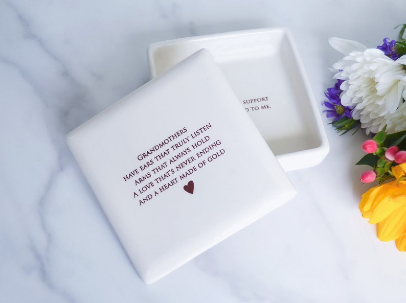 White ceramic box with a lid. The box has a quote about grandmothers on the lid and personalized text on the inside.