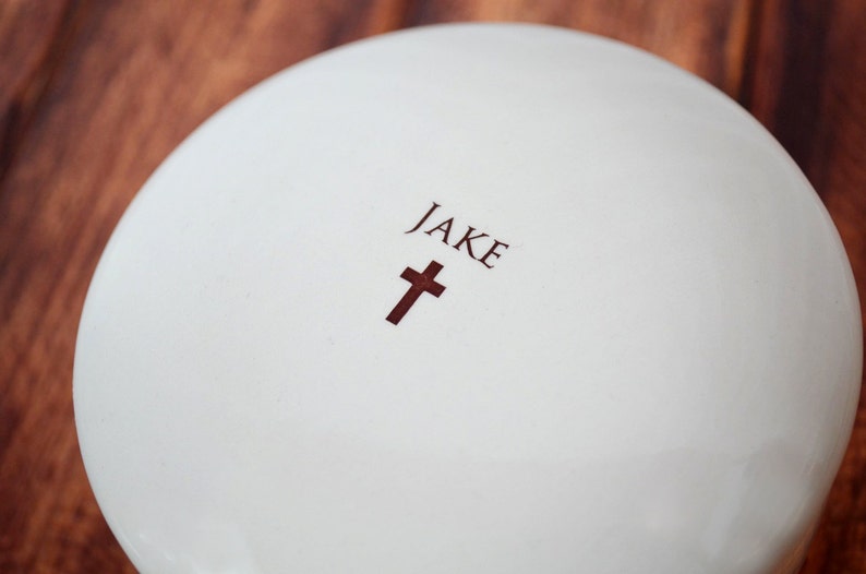 This lovely round keepsake box would be a perfect baptism, christening, first communion, or confirmation gift. It can be personalized with a name and custom message.